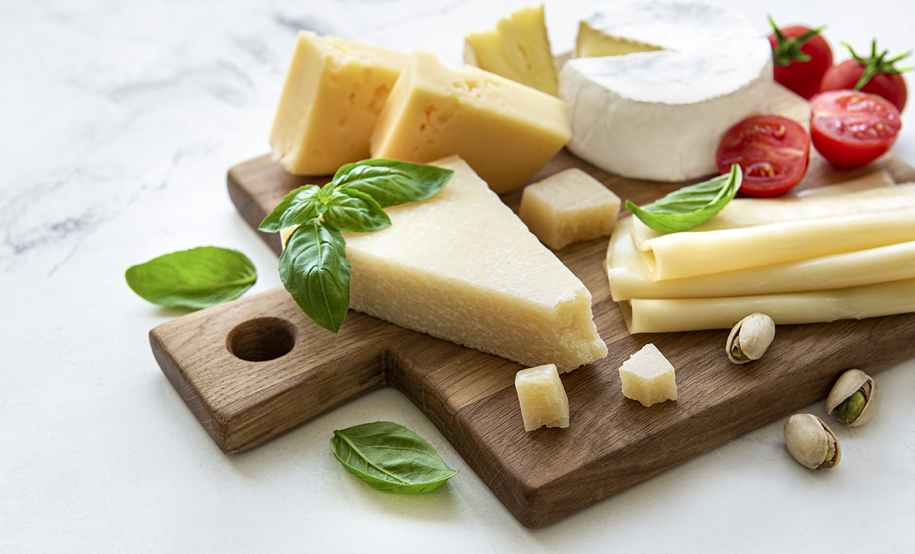 Various types of cheese and snacks